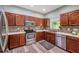 Bright kitchen with wood cabinets, stainless steel appliances, and mosaic backsplash at 10925 Oyster Bay Cir, New Port Richey, FL 34654