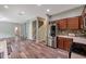 Updated kitchen with stainless steel refrigerator and mosaic backsplash at 10925 Oyster Bay Cir, New Port Richey, FL 34654
