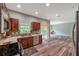 Updated kitchen featuring wood cabinets, stainless steel appliances, and modern tile backsplash at 10925 Oyster Bay Cir, New Port Richey, FL 34654