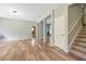 Inviting living room with wood floors and staircase to upper level at 10925 Oyster Bay Cir, New Port Richey, FL 34654