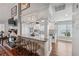Bright kitchen featuring white cabinetry, a marble countertop island with seating, and stainless steel appliances at 11505 Cerca Del Rio, Temple Terrace, FL 33617