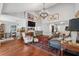Spacious living room featuring hardwood floors, a fireplace, and open floorplan at 11505 Cerca Del Rio, Temple Terrace, FL 33617