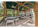 Covered patio with tables and chairs, ideal for gatherings and enjoying the beautiful community surroundings at 11505 Cerca Del Rio, Temple Terrace, FL 33617