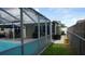 Backyard view showing the pool and the fenced in yard at 11810 Oceanside Dr, Port Richey, FL 34668