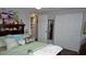 Bedroom featuring decorative pillows, large closet, and nautical-themed decor above the headboard at 11810 Oceanside Dr, Port Richey, FL 34668