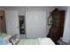 This bedroom shows a large closet for storage at 11810 Oceanside Dr, Port Richey, FL 34668