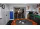 This game room features a poker table and collectible display cases at 11810 Oceanside Dr, Port Richey, FL 34668
