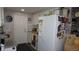 Kitchen featuring white cabinets, granite countertops, and stainless-steel appliances at 11810 Oceanside Dr, Port Richey, FL 34668