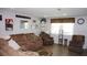 Living room featuring a comfortable sofa, neutral colors, and a large window at 11810 Oceanside Dr, Port Richey, FL 34668