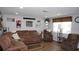 Cozy living room with comfortable seating and a large window for natural light at 11810 Oceanside Dr, Port Richey, FL 34668