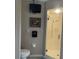 Modern bathroom with glass-enclosed shower, tiled floors, and neutral color scheme at 1231 Etta Ave, Spring Hill, FL 34609
