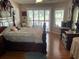 Spacious bedroom with lots of natural light, beautiful furnishings, and wood laminate flooring at 1231 Etta Ave, Spring Hill, FL 34609