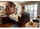 This bedroom has a bed with dark wood frame, a ceiling fan, and sliding glass doors at 1231 Etta Ave, Spring Hill, FL 34609