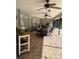 Covered patio with ceiling fans, tile flooring, and an outdoor dining set at 1231 Etta Ave, Spring Hill, FL 34609