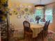 Bright dining room with decorative plates on the wall and a table set for six at 1231 Etta Ave, Spring Hill, FL 34609