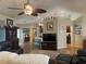 Open-concept living space with hardwood floors, leading to a modern kitchen and dining area with ample natural light at 1231 Etta Ave, Spring Hill, FL 34609