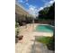 Backyard view of swimming pool, patio, and landscaping surrounding the home at 1231 Etta Ave, Spring Hill, FL 34609
