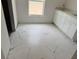 Bathroom showcasing gorgeous marble-look tile flooring and a modern vanity at 14586 Mocking Wren Rd, Weeki Wachee, FL 34614