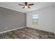 Bedroom with a window and gray wall at 16104 Naples St, Brooksville, FL 34604