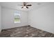 Bright bedroom with ceiling fan and a window at 16104 Naples St, Brooksville, FL 34604