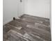 Walk-in closet with wood-look flooring and wire shelving at 16104 Naples St, Brooksville, FL 34604