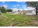 Image showing multiple mobile homes featuring gray siding and adjacent backyards at 16104 Naples St, Brooksville, FL 34604