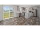 Modern kitchen with stainless steel appliances, a center island, and a sliding door to the outdoor deck at 16104 Naples St, Brooksville, FL 34604