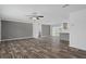 Spacious living area with sleek flooring and seamless transition to the adjacent kitchen and outdoor access at 16104 Naples St, Brooksville, FL 34604
