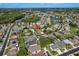 An aerial view of a single-Gathering home in a residential neighborhood with community lakes at 1831 Cardamon Dr, Trinity, FL 34655