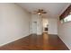 Comfortable bedroom featuring wood floors, ceiling fan, and ensuite bathroom access at 1831 Cardamon Dr, Trinity, FL 34655