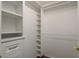 White closet system with shelving, drawers and ample storage space for organization at 1831 Cardamon Dr, Trinity, FL 34655