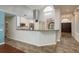 Modern kitchen featuring granite countertops, stainless steel appliances, and open breakfast bar at 1831 Cardamon Dr, Trinity, FL 34655