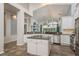 Elegant kitchen with a center island, stainless steel appliances, and open layout at 1831 Cardamon Dr, Trinity, FL 34655