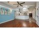 Spacious living room with high ceilings, stylish lighting, and open layout connecting to the kitchen at 1831 Cardamon Dr, Trinity, FL 34655