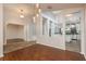 Open floor plan featuring hardwood floors and views into the kitchen and another living space at 1831 Cardamon Dr, Trinity, FL 34655
