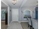 Bright entryway featuring tiled floors, neutral paint, and an adjacent dining area at 2027 Fentress Ct, Spring Hill, FL 34609