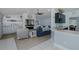 Open living area with fireplace, TV, built-ins, and view of the kitchen at 2027 Fentress Ct, Spring Hill, FL 34609