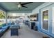 Covered patio with cozy seating, a fire pit, and outdoor entertainment options, perfect for relaxation at 2027 Fentress Ct, Spring Hill, FL 34609