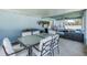 Spacious covered patio featuring outdoor dining and living areas, ideal for entertaining guests at 2027 Fentress Ct, Spring Hill, FL 34609
