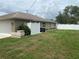 A well-maintained backyard featuring a white vinyl fence, green grass, and an AC unit at 3128 Montague Ave, Spring Hill, FL 34608