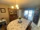 Traditional dining room featuring an oval table, hutch and sliding door at 3128 Montague Ave, Spring Hill, FL 34608