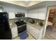 Well-lit kitchen featuring granite counters and stainless steel appliances at 3128 Montague Ave, Spring Hill, FL 34608