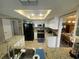 Bright kitchen features granite countertops and a view of the dining area at 3128 Montague Ave, Spring Hill, FL 34608