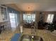 Open kitchen with granite countertops and a view to the dining and living area at 3128 Montague Ave, Spring Hill, FL 34608