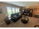 Comfortable living room with a large window, plush seating, and stylish décor at 3128 Montague Ave, Spring Hill, FL 34608