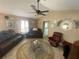 Comfortable living room with plush seating, ceiling fan and neutral tones at 3128 Montague Ave, Spring Hill, FL 34608