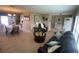 Open floor plan with a living room and adjacent dining area, filled with natural light at 3128 Montague Ave, Spring Hill, FL 34608