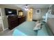 Comfortable main bedroom with a large bed, ample storage, and ensuite bathroom at 3128 Montague Ave, Spring Hill, FL 34608