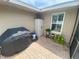 Outdoor patio area with brick pavers and a garden shed for extra storage at 3128 Montague Ave, Spring Hill, FL 34608