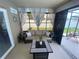 Comfortable screened patio seating with views of the backyard at 3128 Montague Ave, Spring Hill, FL 34608